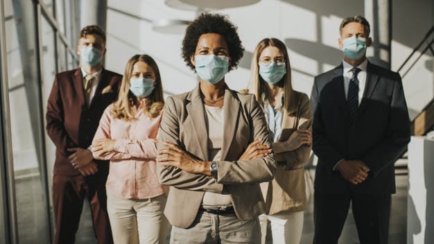 Group of asian business people standing in office and wear mask